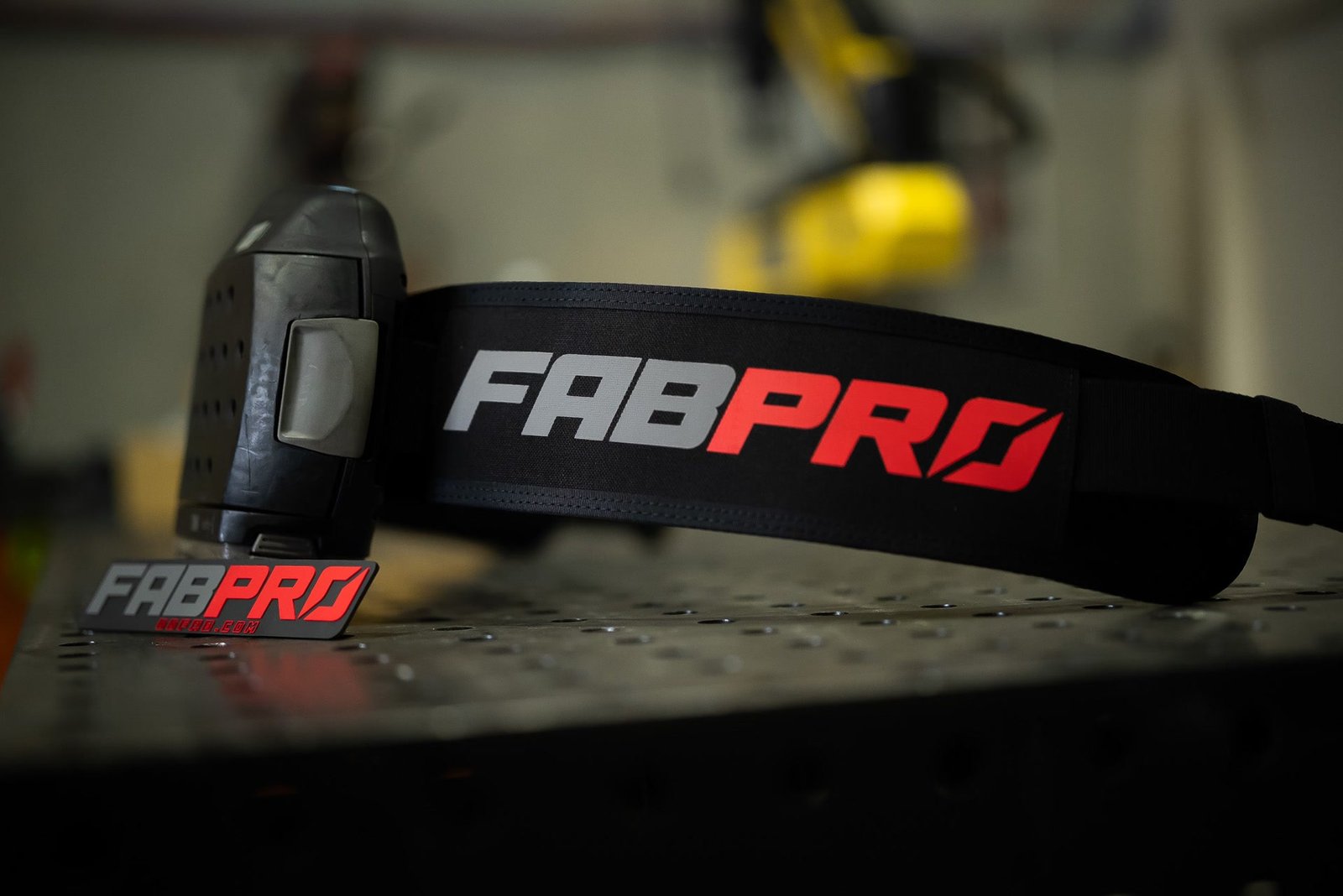 FabPro welding belt with a 3M Adflo unit resting on a FabPro welding table